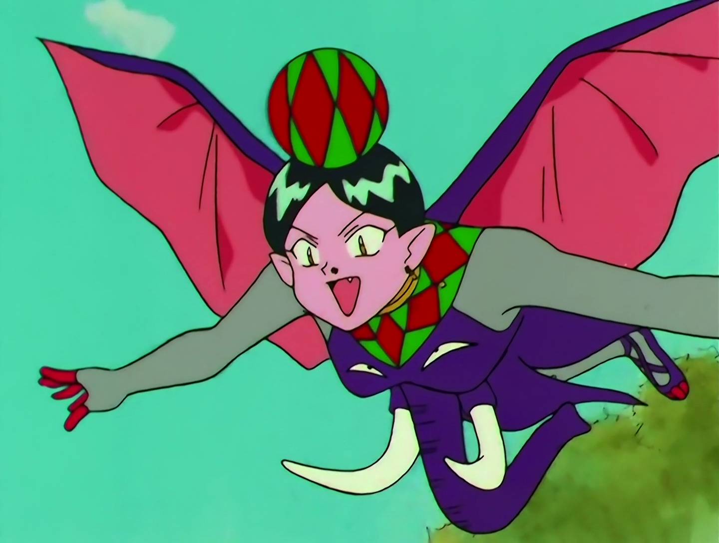 PaoPao Musume, a Lemures from Sailor Moon episode 157. She has pink skin and black hair, and is gliding. Her torso looks like a purple elephant face, complete with a trunk sticking out in front of her. The elephant’s ears form a large pair of wings. Her sleeves are gray, she has a red and green ball on her head, and a red and green collar.